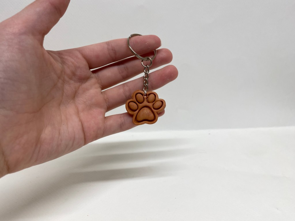 Polymer clay, terra-cotta color paw keychain